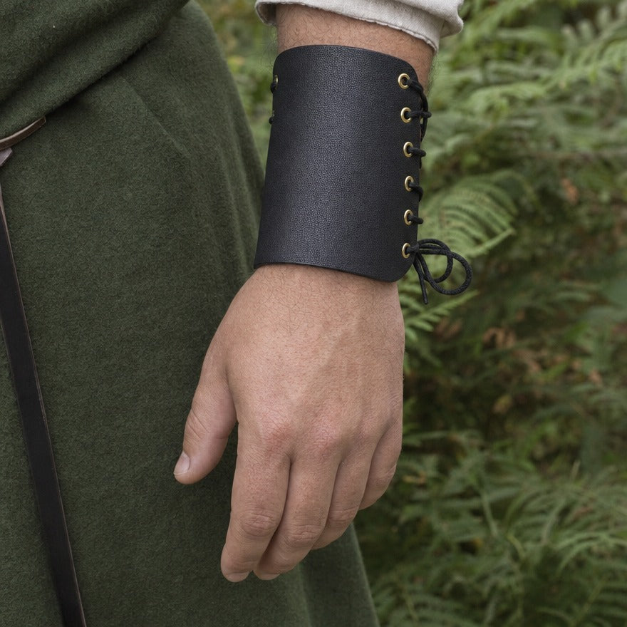 Laced wrist guard on a forearm, showing the 15.5 cm length above the wrist