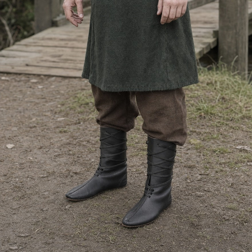 Mid-calf lace-up boots on a wearer, showing the shaft height