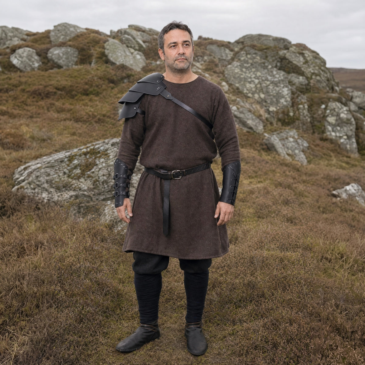 Black pauldron and bracers set worn outdoors, full-length front view