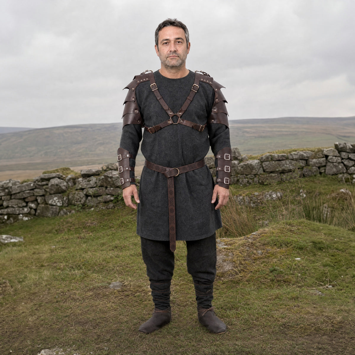 Brown pauldron armour set with buckled bracers worn outdoors, full-length front view