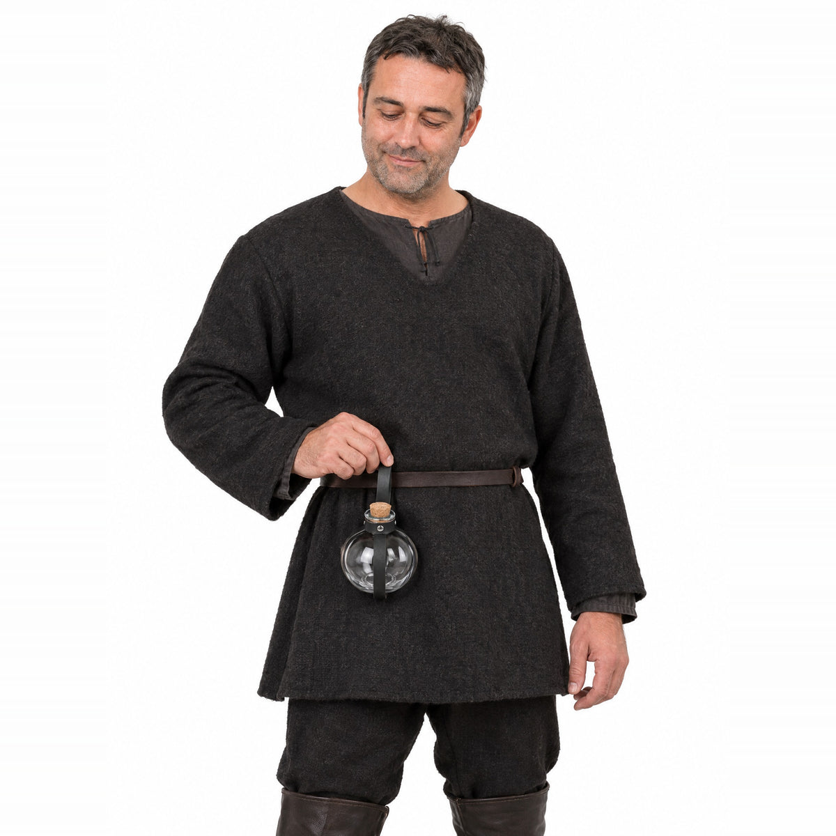Black round potion bottle with belt holder worn by a model on a white background