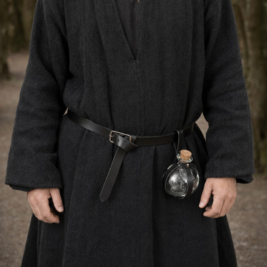 Round potion bottle with belt holder on a wearer's belt, showing the bottle size against the hip