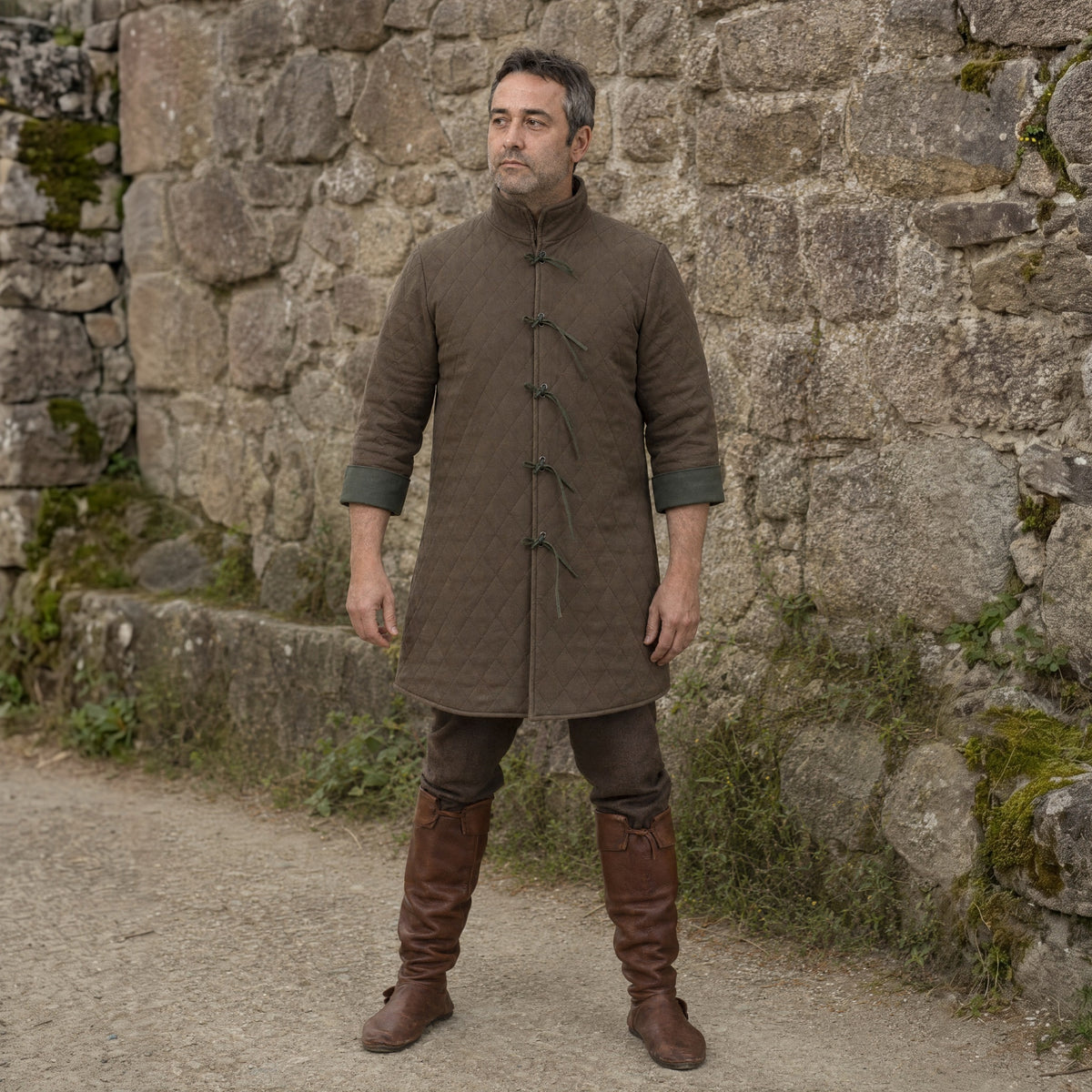 Dark Brown quilted padded coat worn by a man outdoors, full-length front view