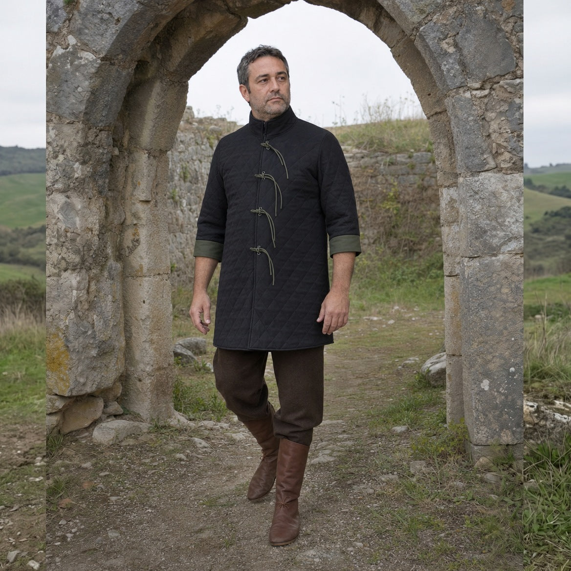 Black quilted padded coat worn outdoors