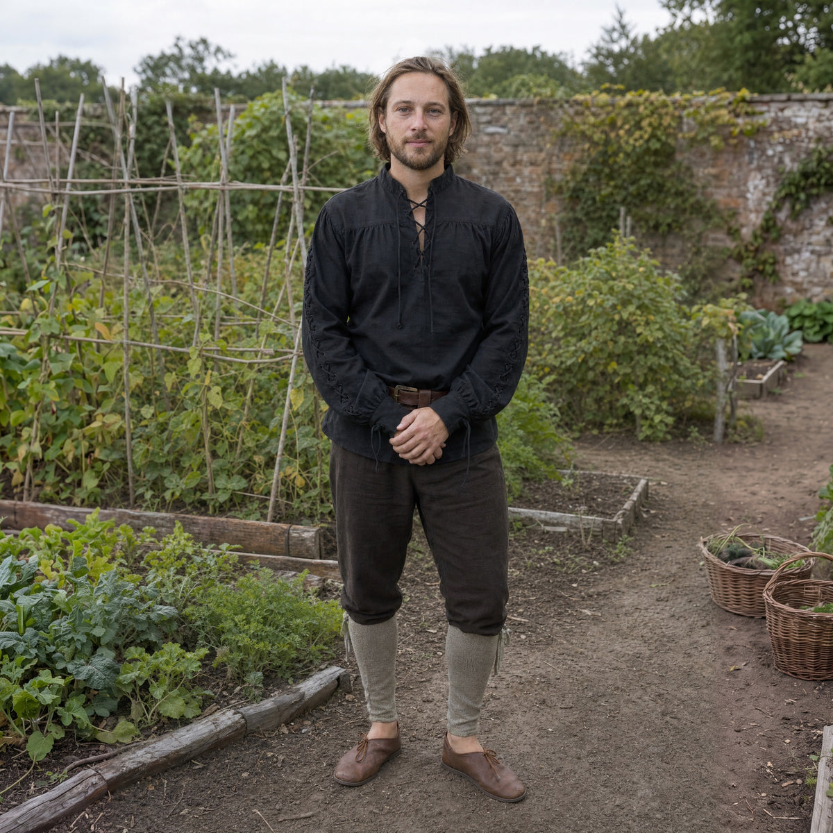 Black Renaissance shirt with laced sleeves worn by a man outdoors, full-length front view