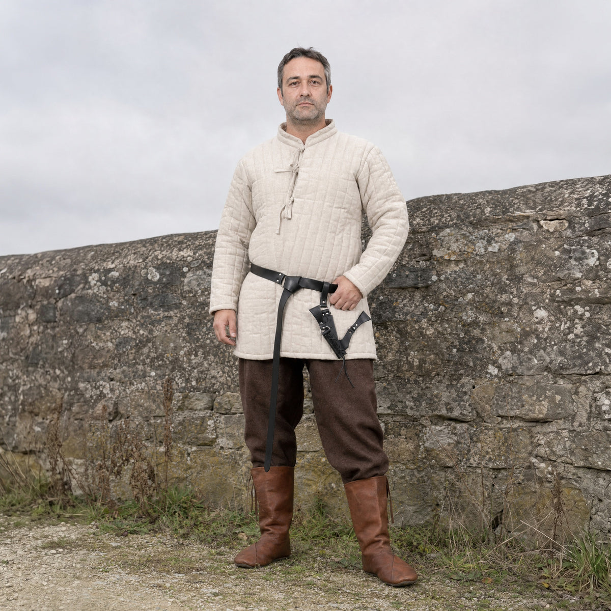 Black ring belt with V-shaped sword frog worn outdoors, full-length front view