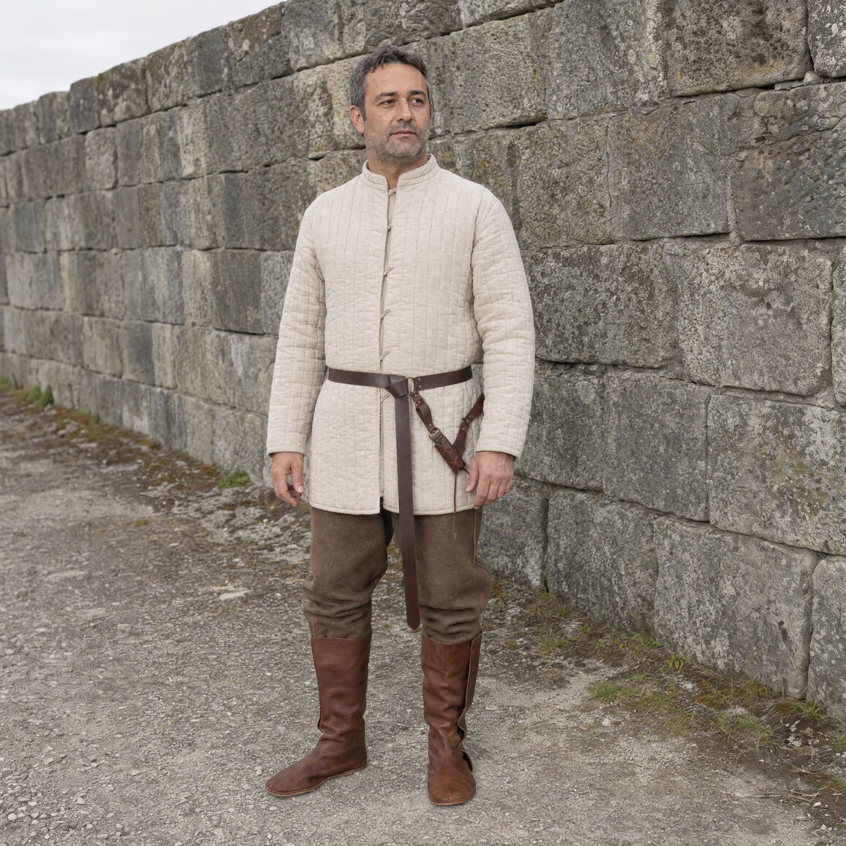 Brown ring belt with V-shaped sword frog worn outdoors, full-length front view