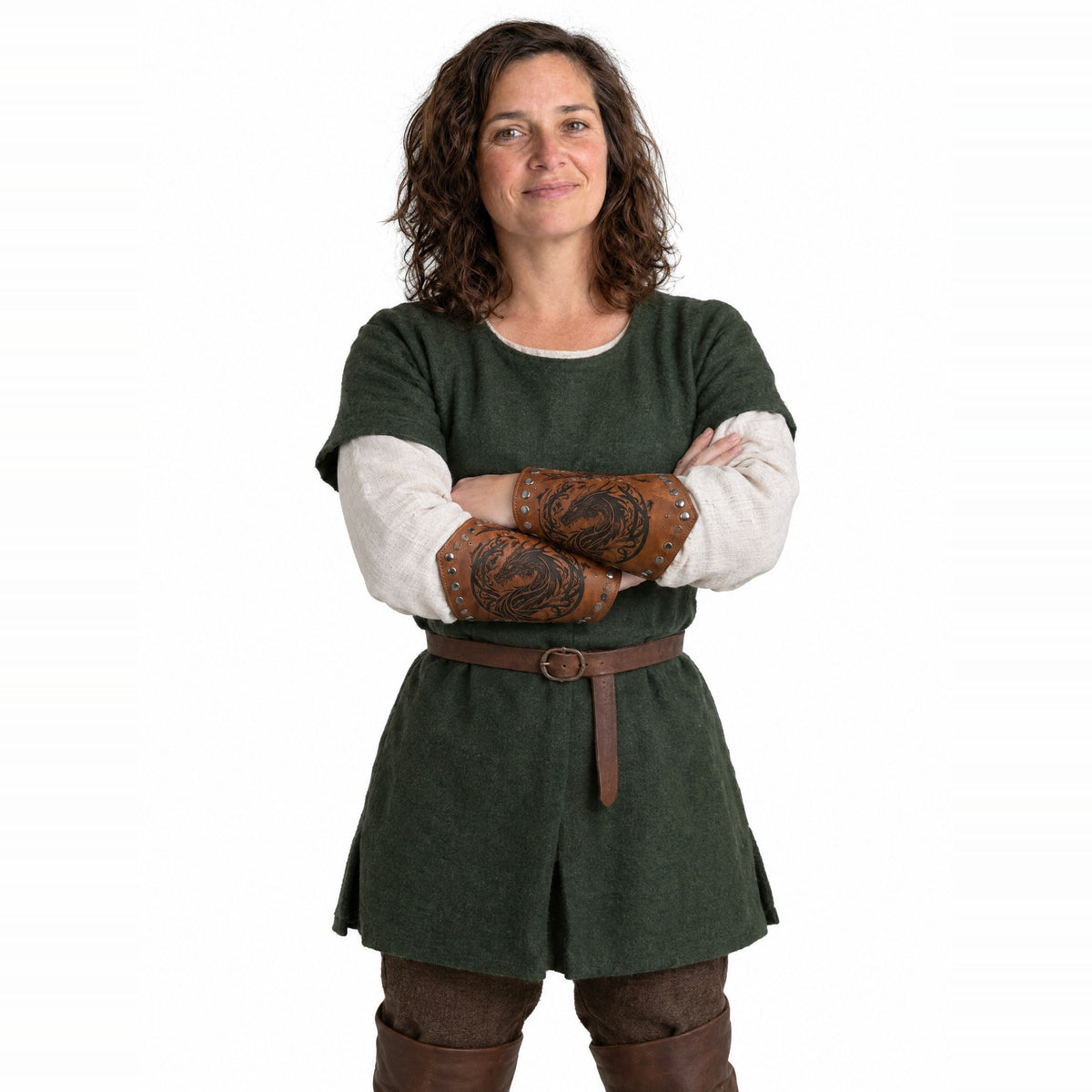 Brown riveted dragon bracers worn by a model on a white background