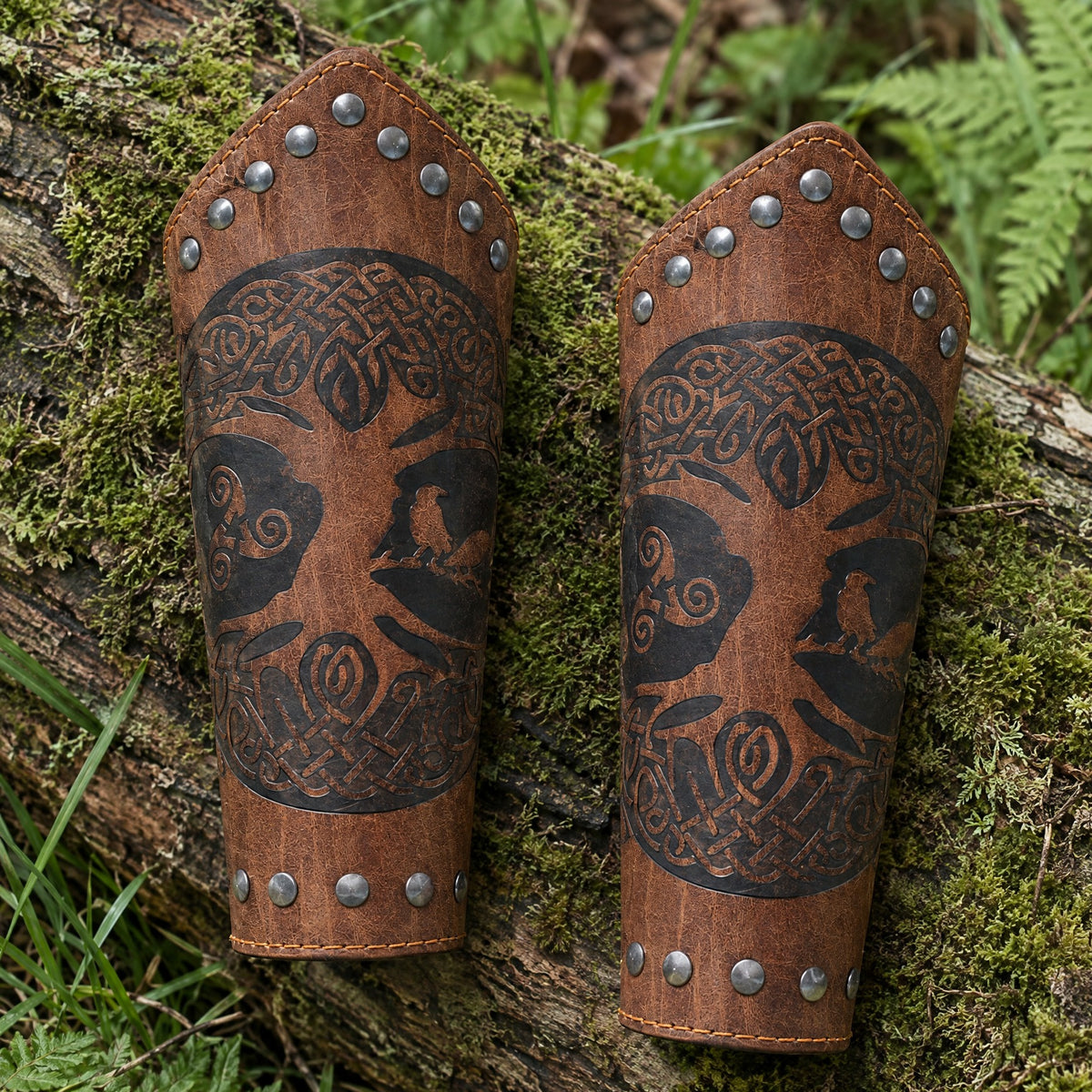 Brown riveted World Tree bracers on a rustic surface