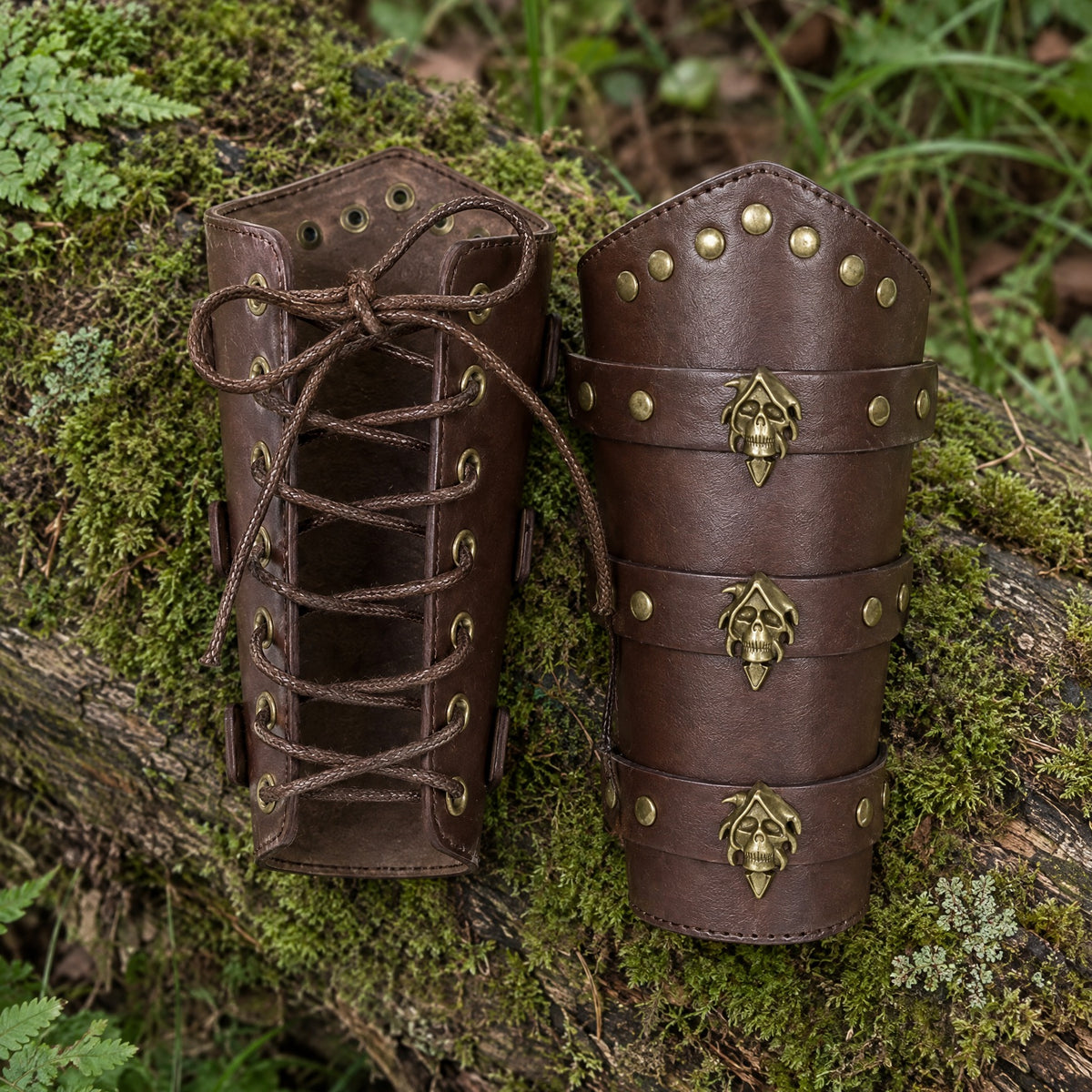Brown riveted bracers with metal fittings on a rustic surface