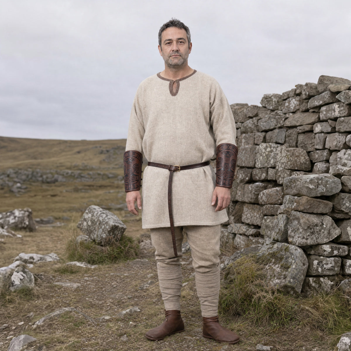 Brown tall Thor's hammer bracers worn outdoors, full-length front view