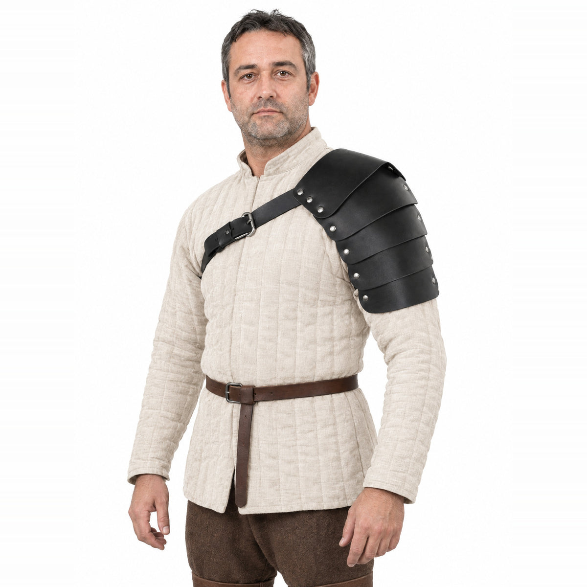 Black segmented single pauldron worn by a model on a white background