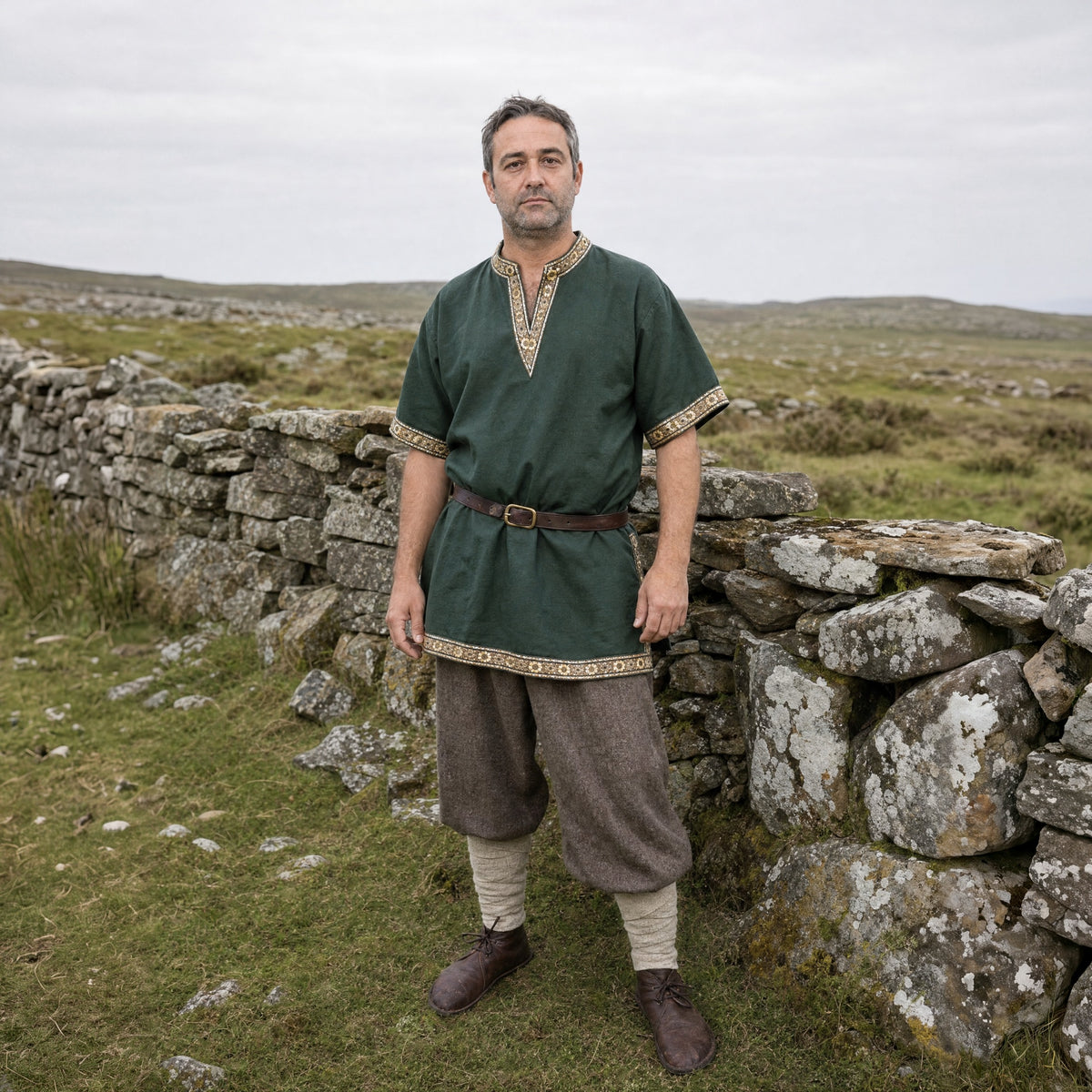 Army Green short-sleeve V-neck tunic worn by a man outdoors, full-length front view