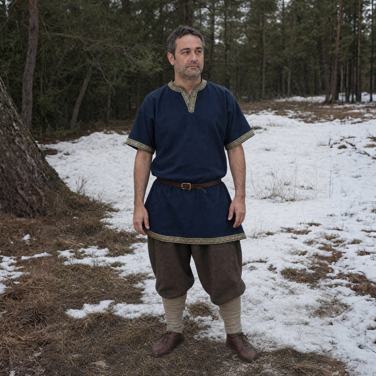 Dark Blue short-sleeve V-neck tunic worn by a man outdoors, full-length front view