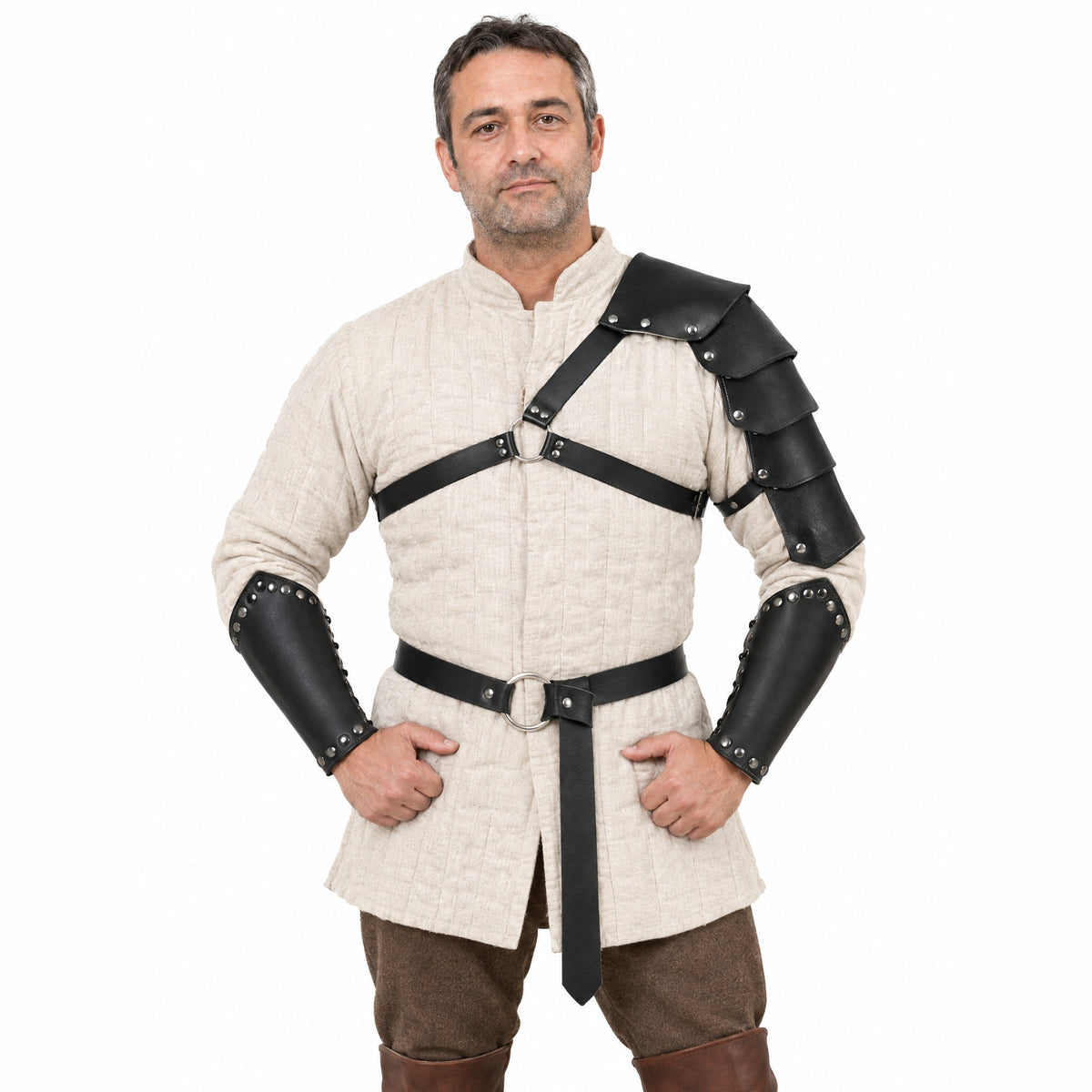 Black shoulder strap set with belt and bracers worn by a model on a white background
