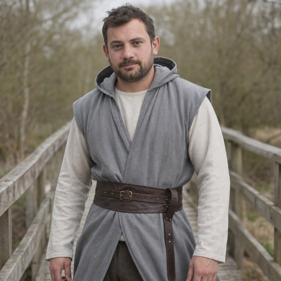 Sleeveless cotton tunic on a wearer, showing the fit across the chest and where the hem falls