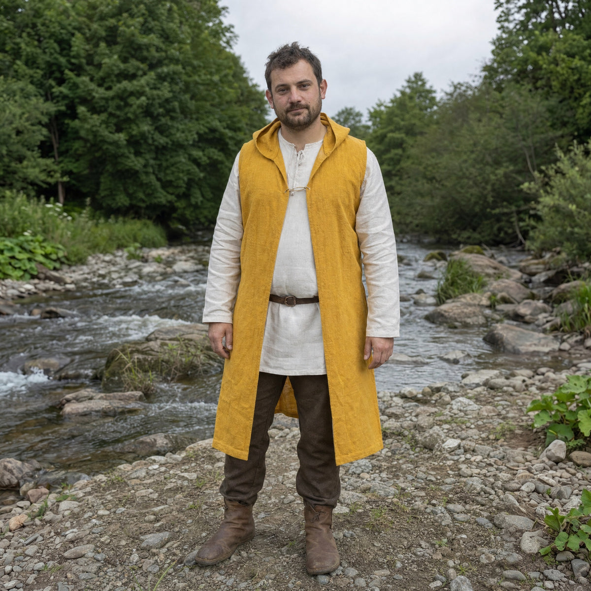 Yellow sleeveless hooded overcoat worn outdoors, full-length front view