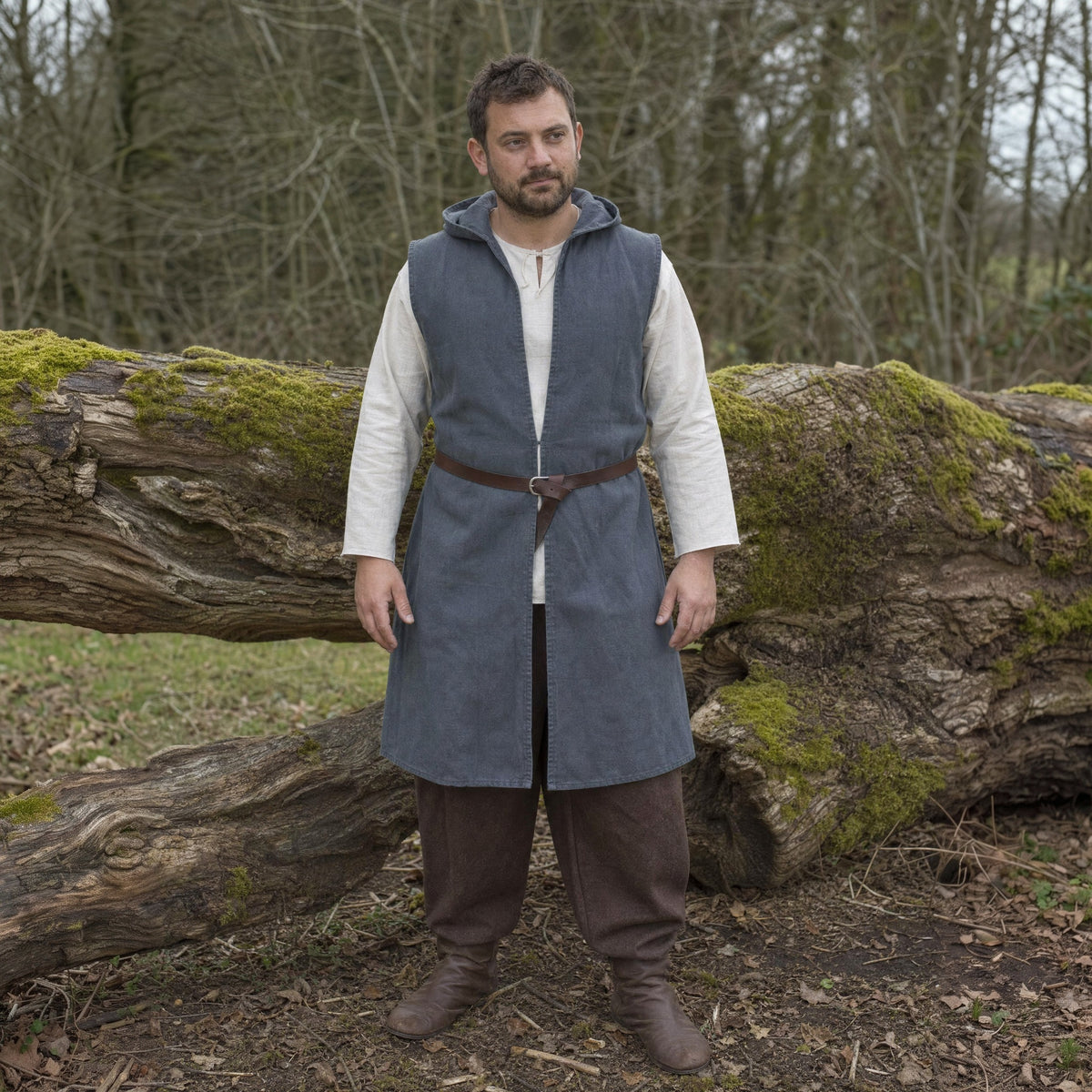 Grey sleeveless hooded overcoat worn outdoors, full-length front view
