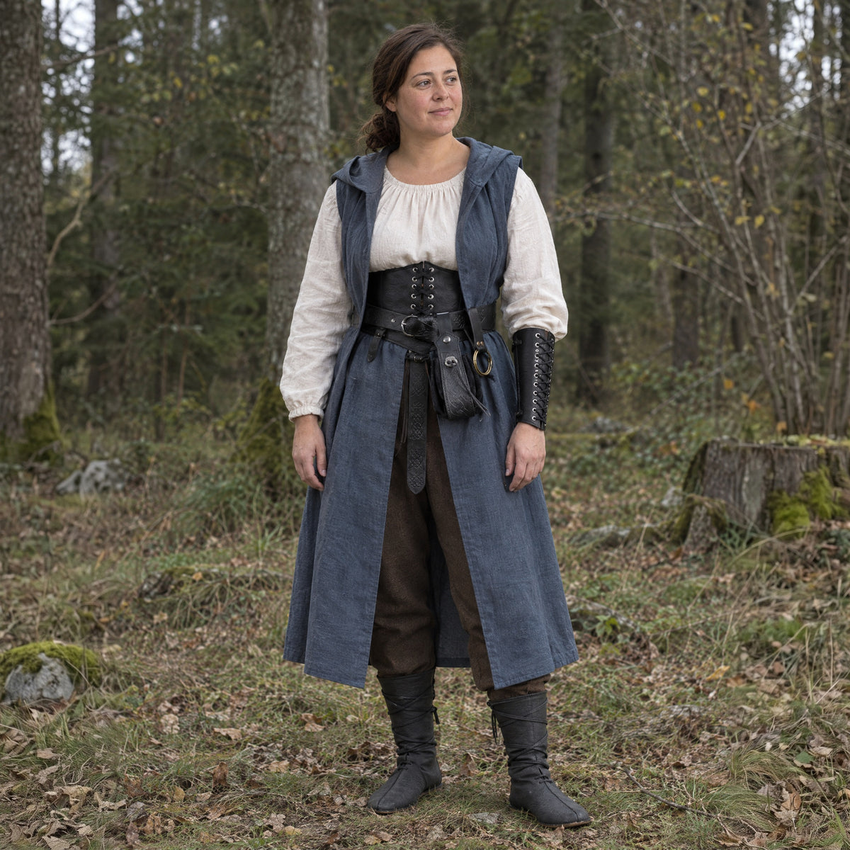 Sleeveless Hooded Overcoat in a complete ranger outfit, worn by a woman outdoors