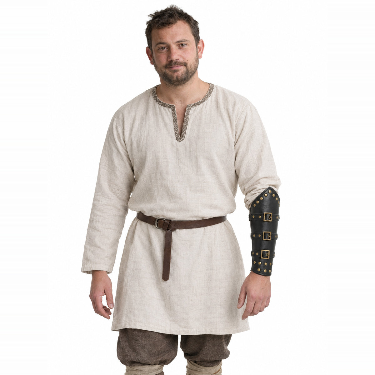 Black studded brass-buckle Viking bracer worn by a model on a white background