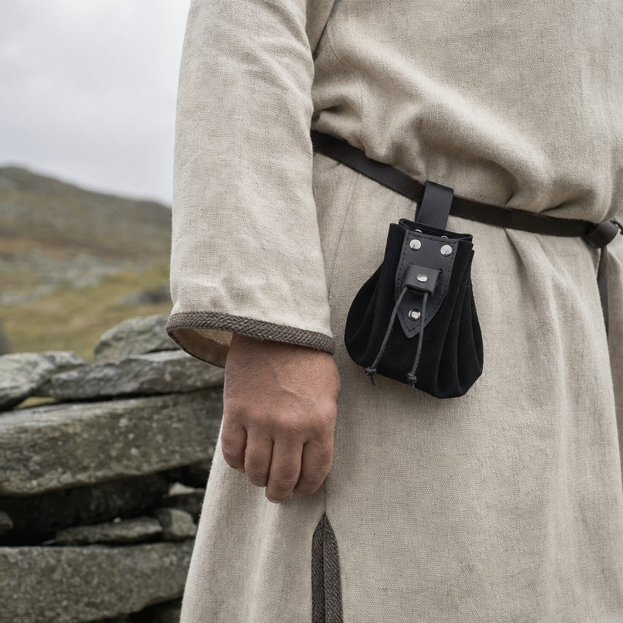 Studded drawstring coin pouch on a wearer's belt, showing its 13 cm body height