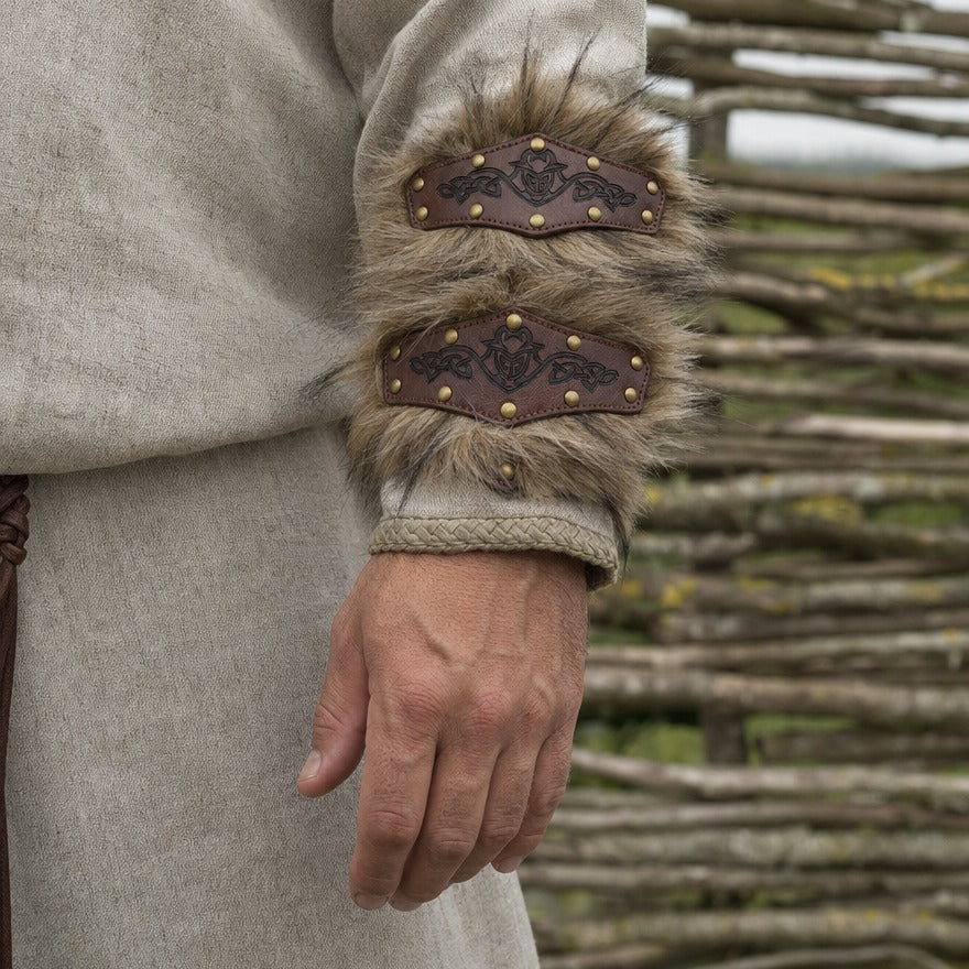 Studded bracer on a forearm, showing the 23 cm length from wrist towards elbow