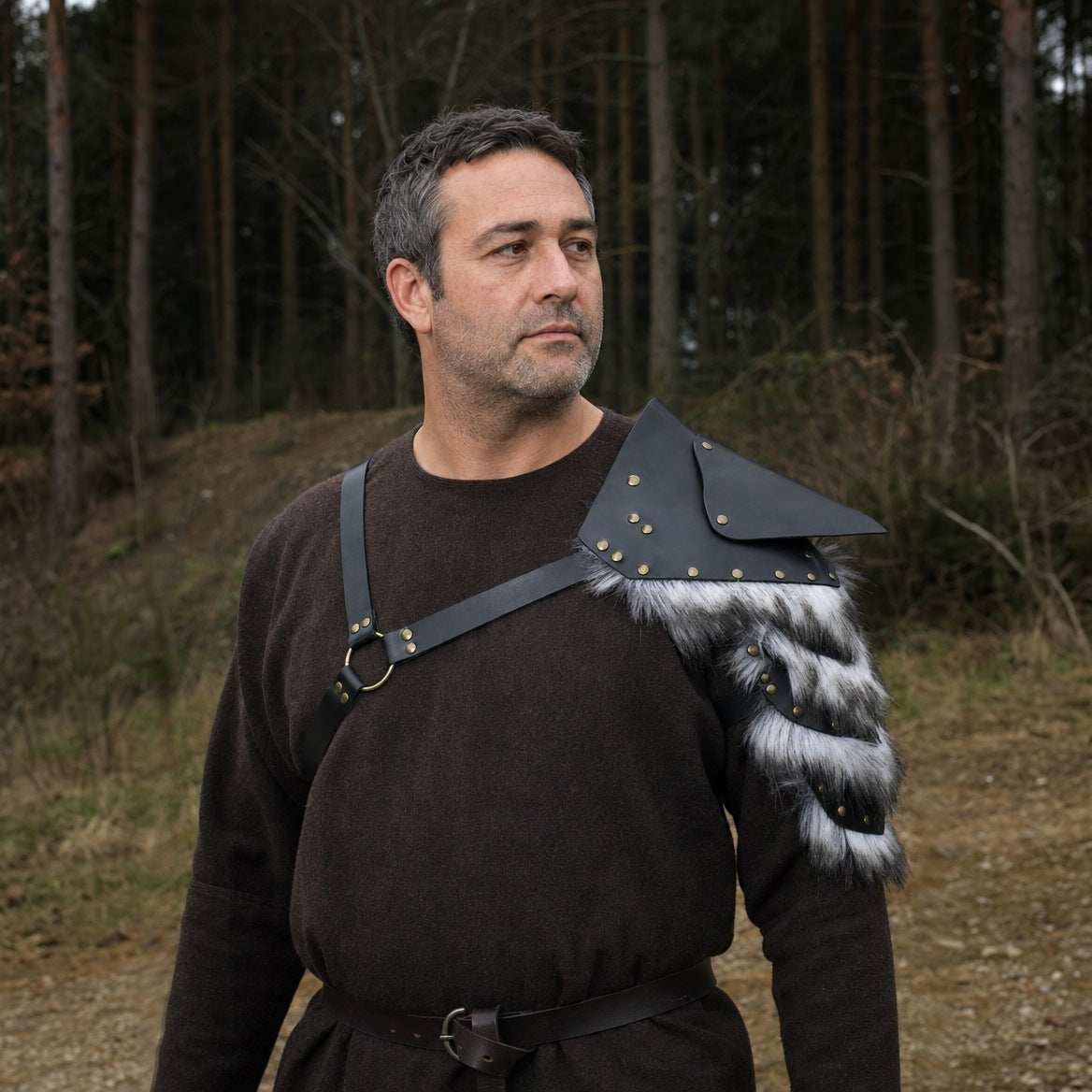 Black studded single pauldron, three-quarter view of the trimmed edge