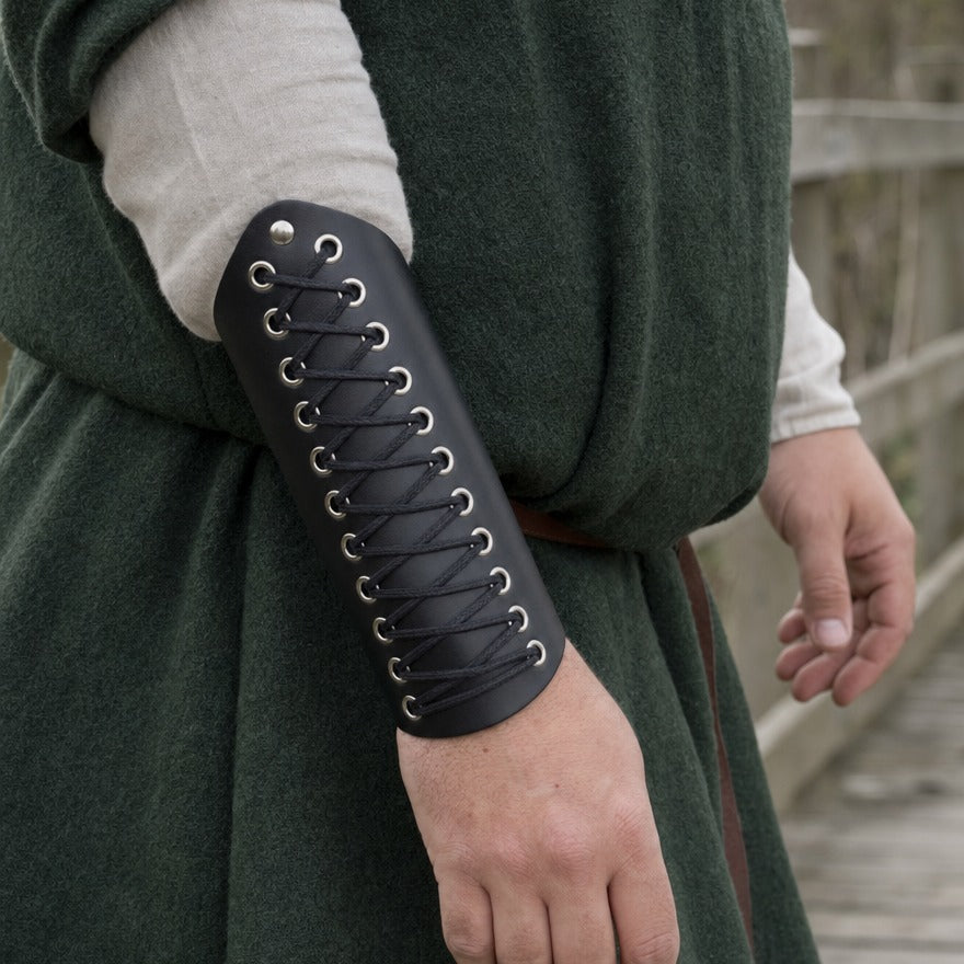 Tapered laced bracer on a forearm, showing the 18.5 cm length from wrist towards elbow