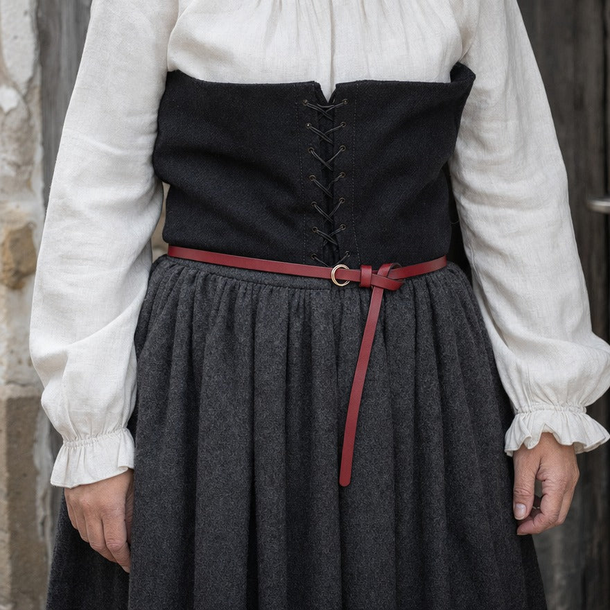 Thin leather ring belt on a wearer, showing the 1 cm strap at the waist