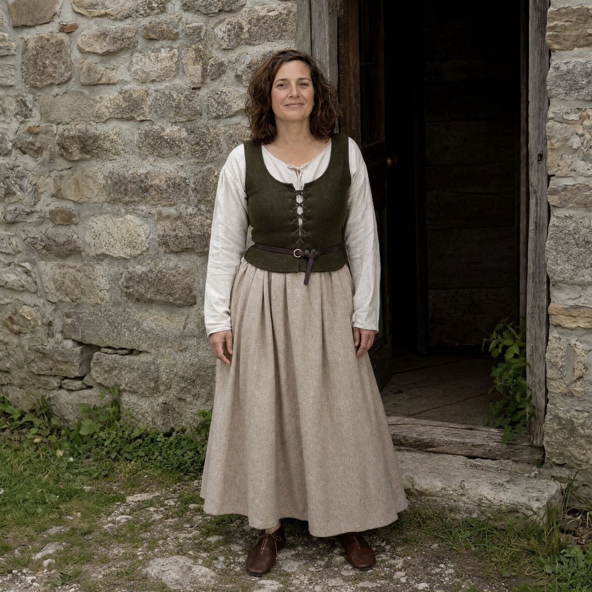 Coffee thin leather ring belt worn by a woman outdoors, full-length front view