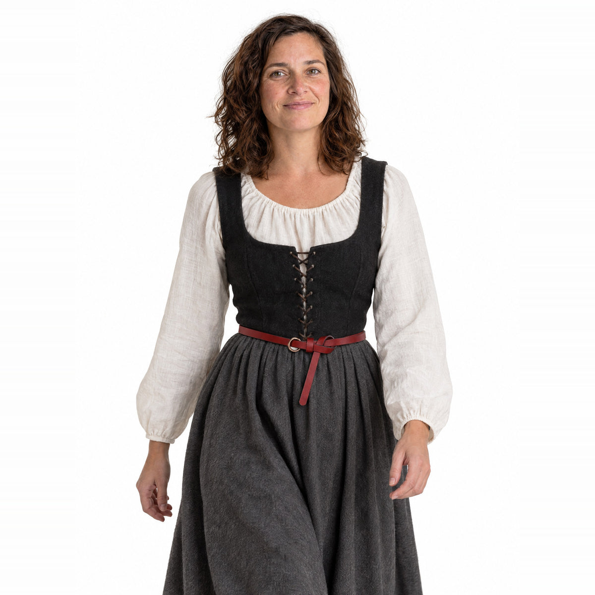 Red thin leather ring belt worn by a model on a white background