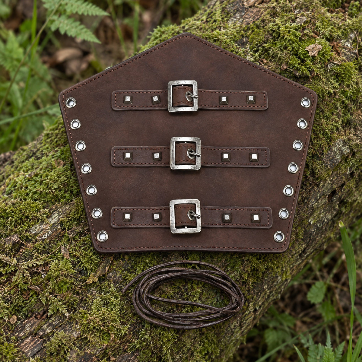 Coffee three-buckle bracer on a rustic surface
