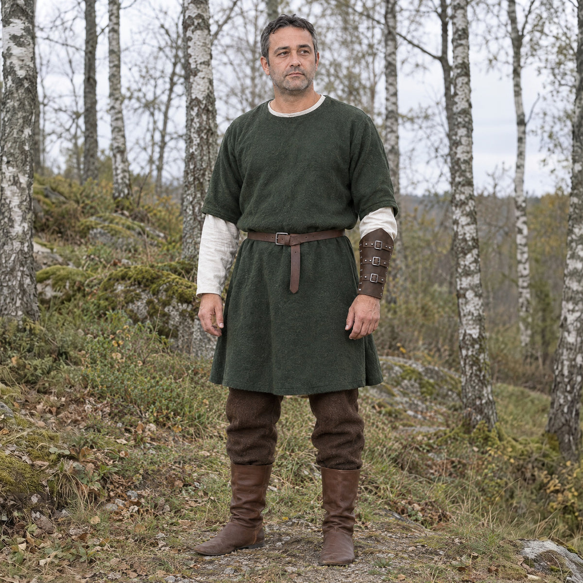 Vintage Brown three-buckle bracer worn on the forearm outdoors, full-length front view
