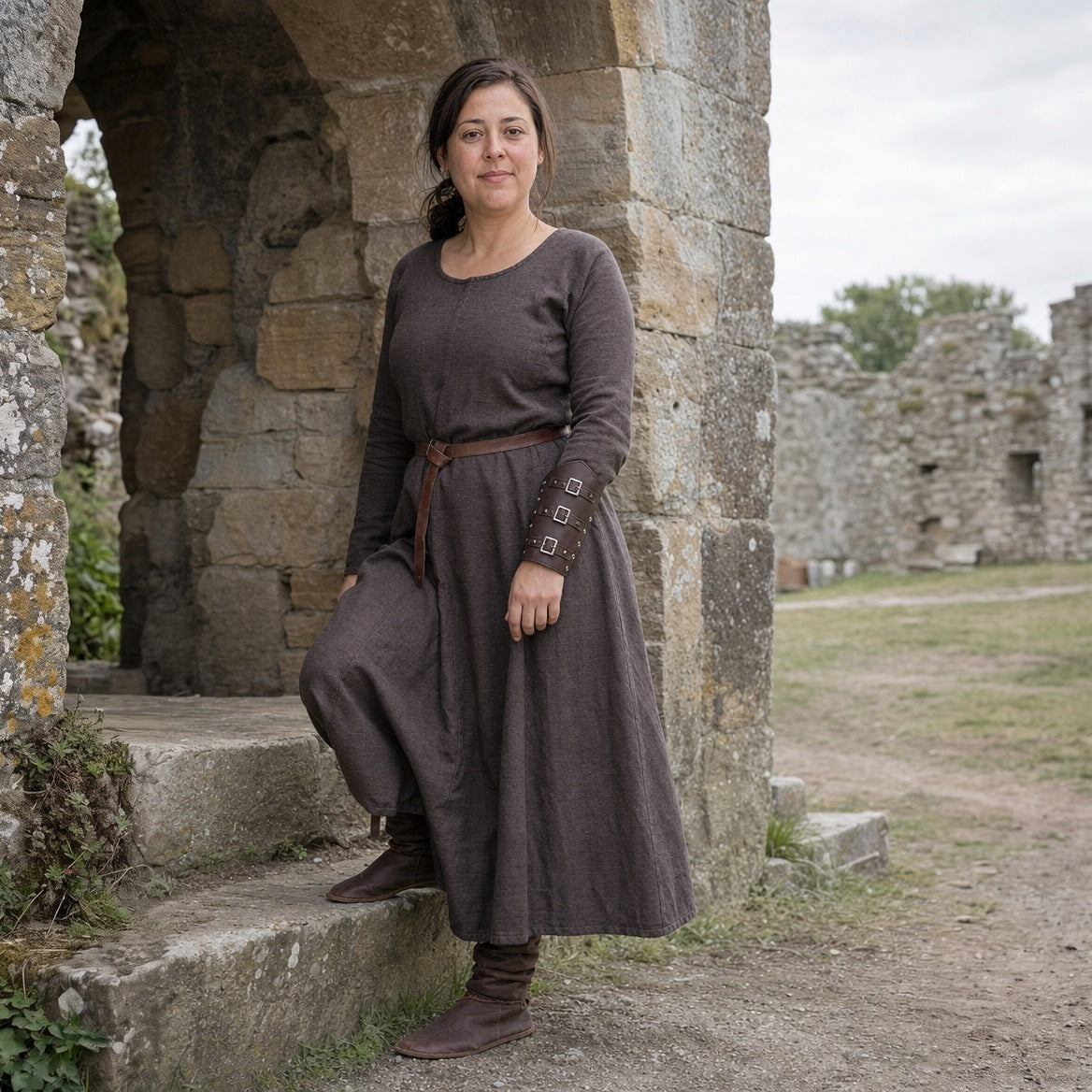 Coffee three-buckle bracer worn outdoors with a long wool dress
