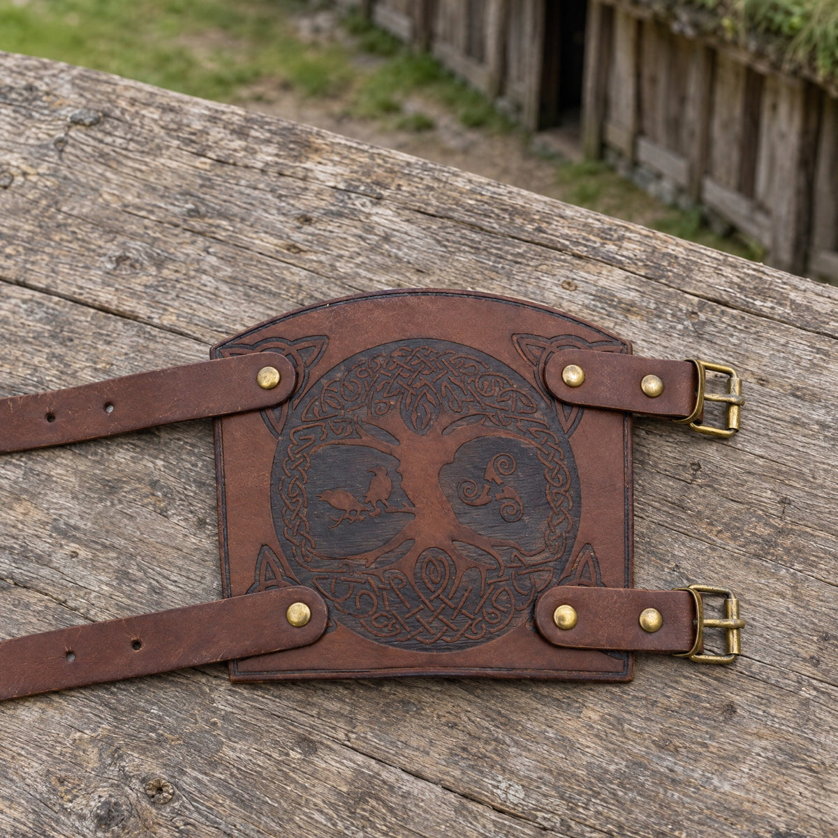 Brown tree of life bracer on a rustic surface