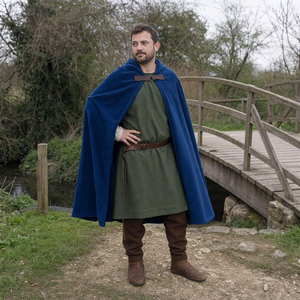 Blue velvet hooded cloak, three-quarter view with the hood up