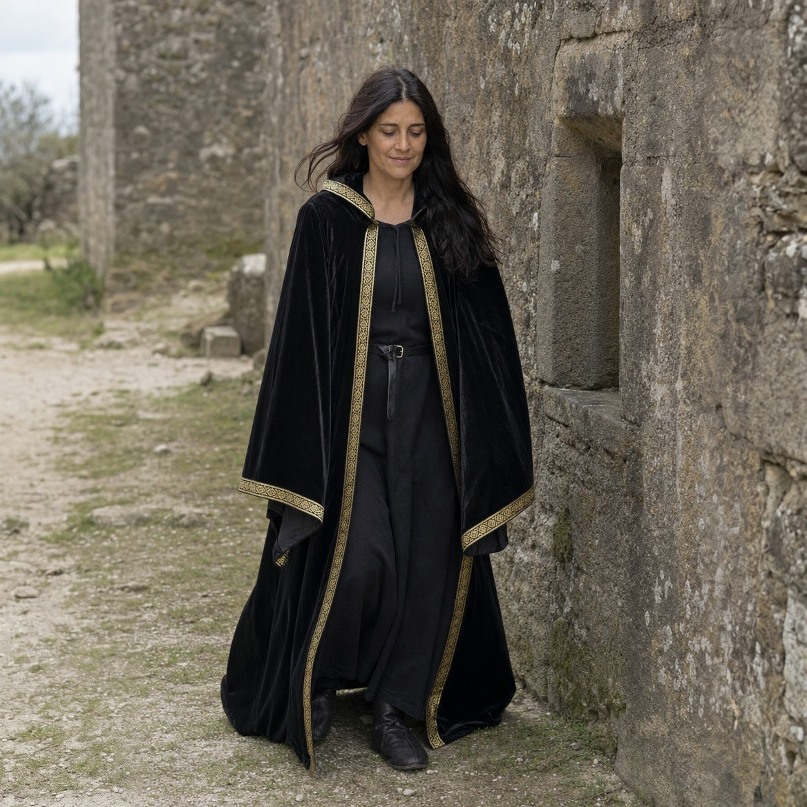 Black velvet hooded robe worn outdoors