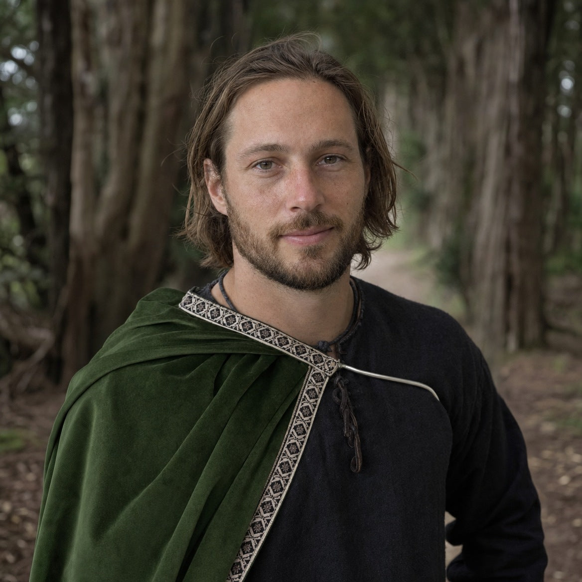 Velvet one-shoulder cape on a wearer, showing how far it hangs