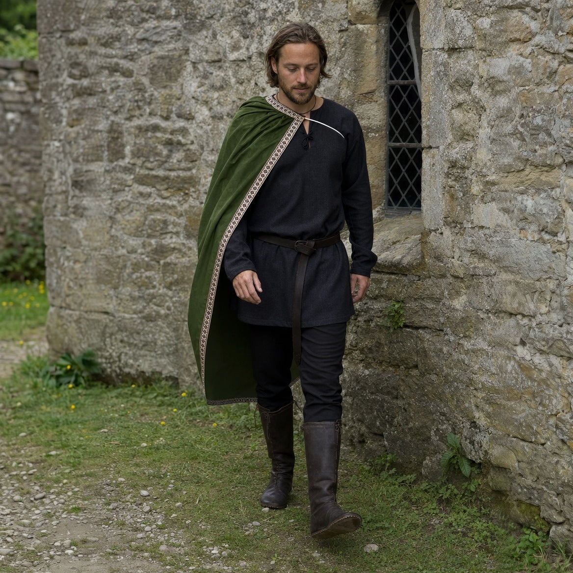 Green velvet one-shoulder cape worn outdoors