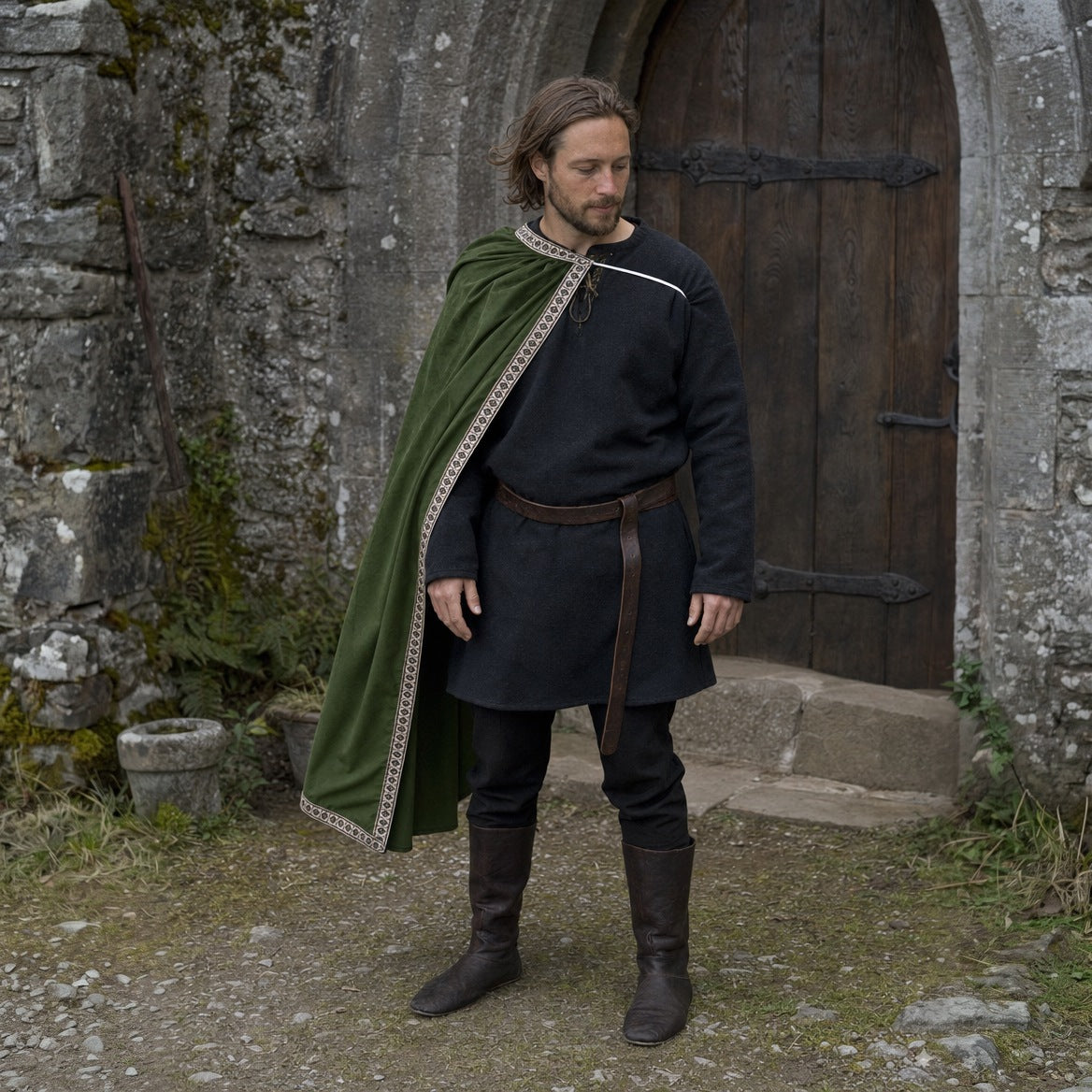 Green velvet one-shoulder cape, three-quarter view of the drape