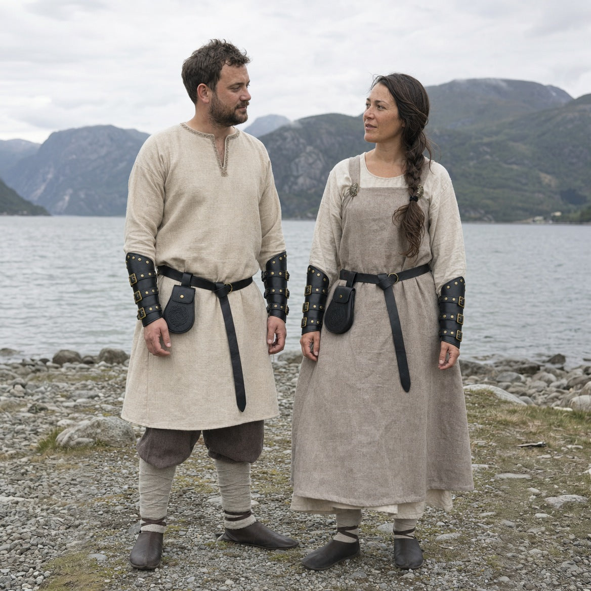 Black Viking belt, pouch and bracers sets worn by a man and a woman outdoors