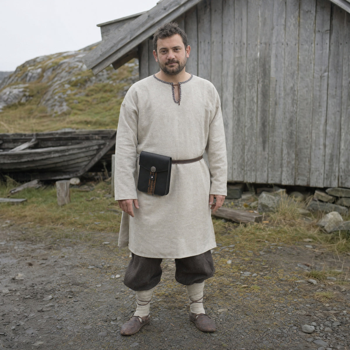 Black tall Viking belt pouch worn at the hip outdoors, full-length front view