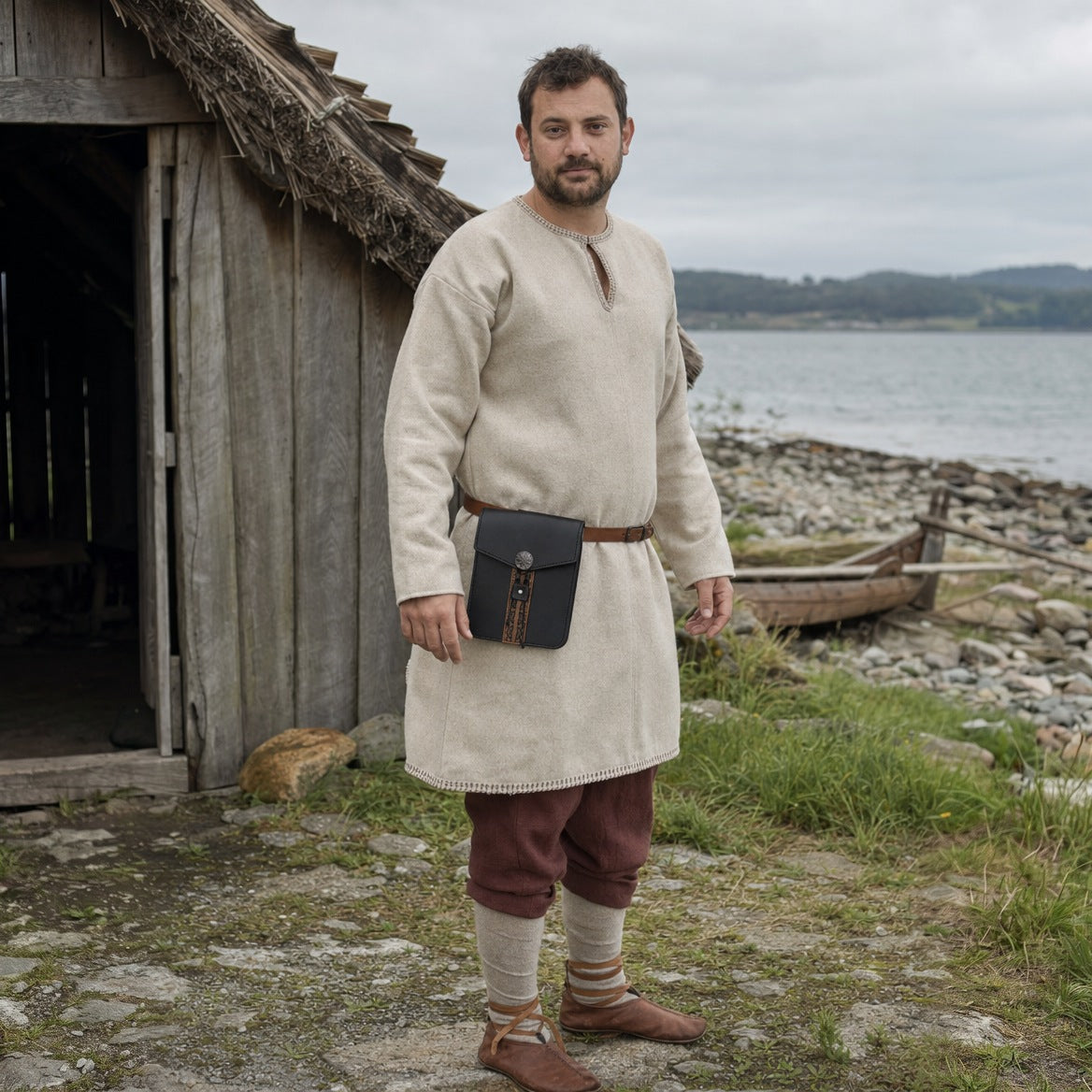 Black tall Viking belt pouch, three-quarter view of the flap and stud