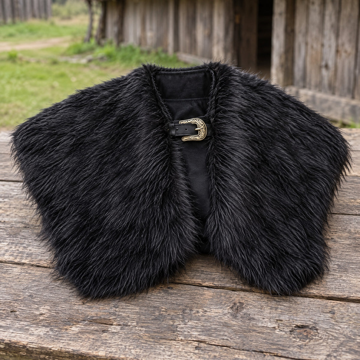 Black viking faux fur shoulder cape on a rustic surface