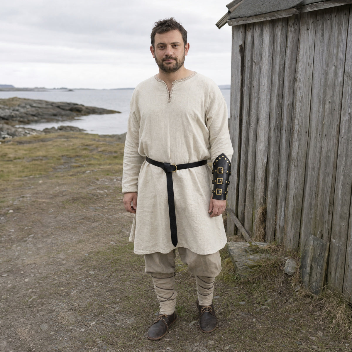 Black Viking ring belt with bracer worn outdoors, full-length front view