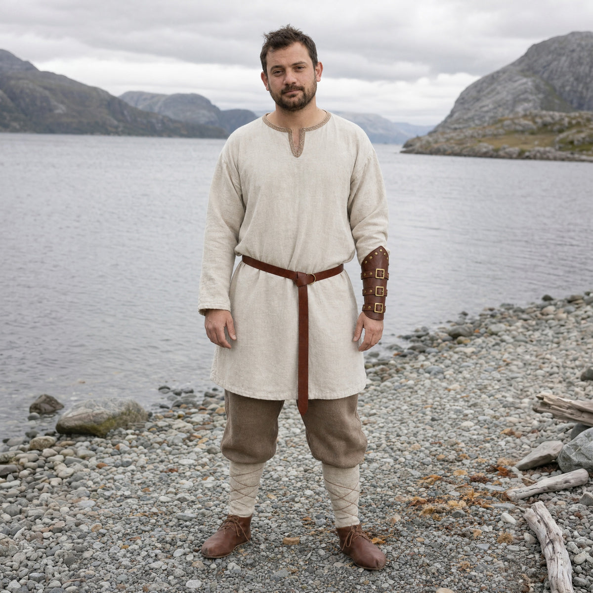 Brown Viking ring belt with bracer worn outdoors, full-length front view