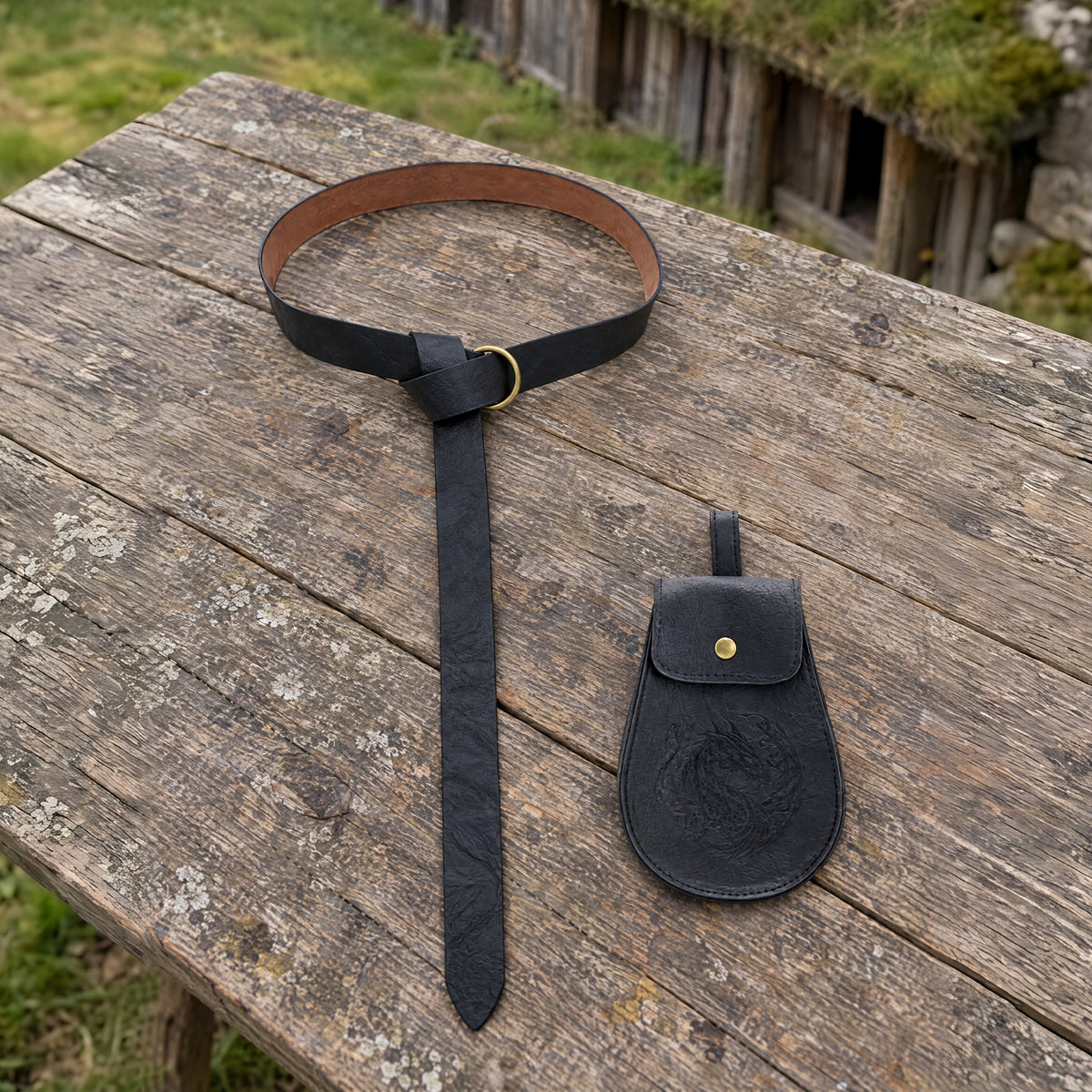 Black Viking ring belt with pouch on a rustic surface