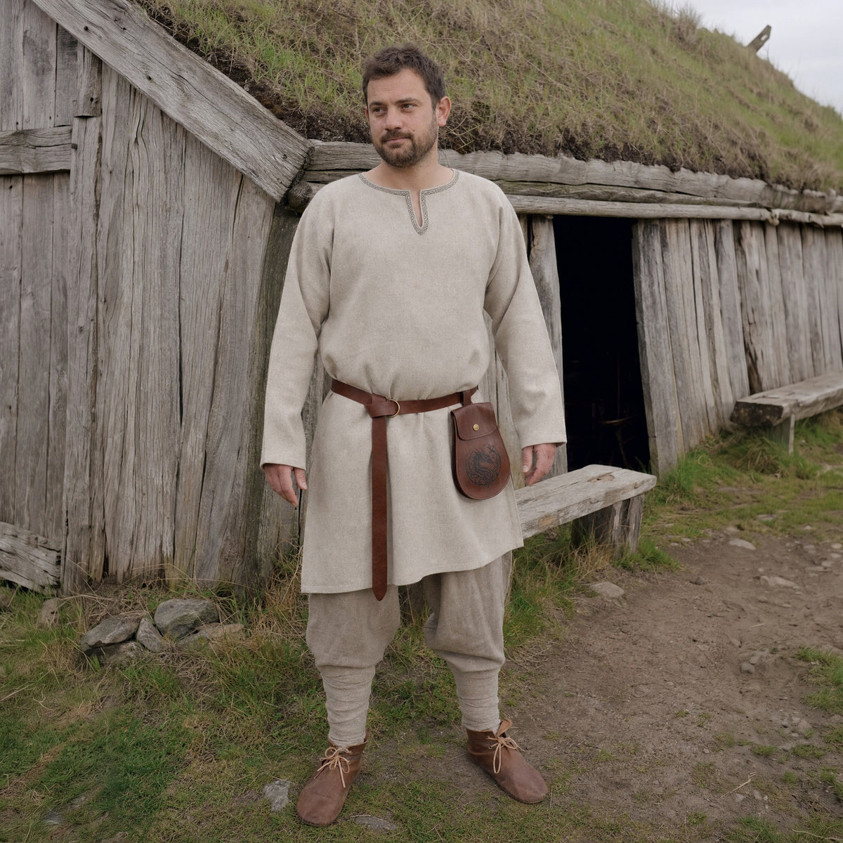 Brown Viking ring belt with pouch worn outdoors, full-length front view
