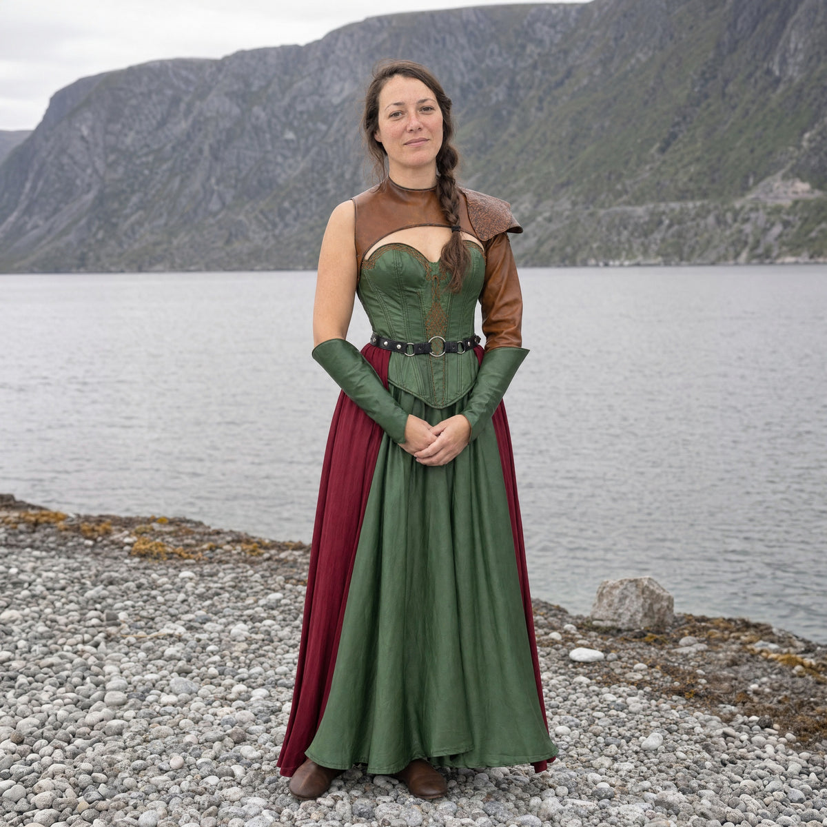 Green satin gown with laced bodice worn by a woman outdoors, full-length front view