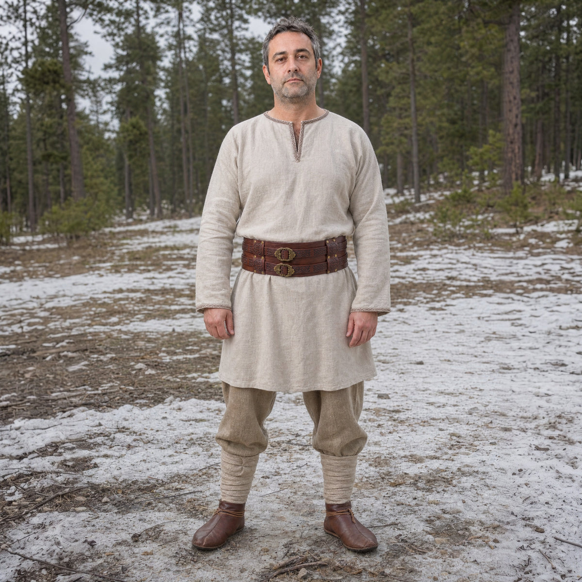 Brown wide double-buckle Celtic belt worn outdoors, full-length front view